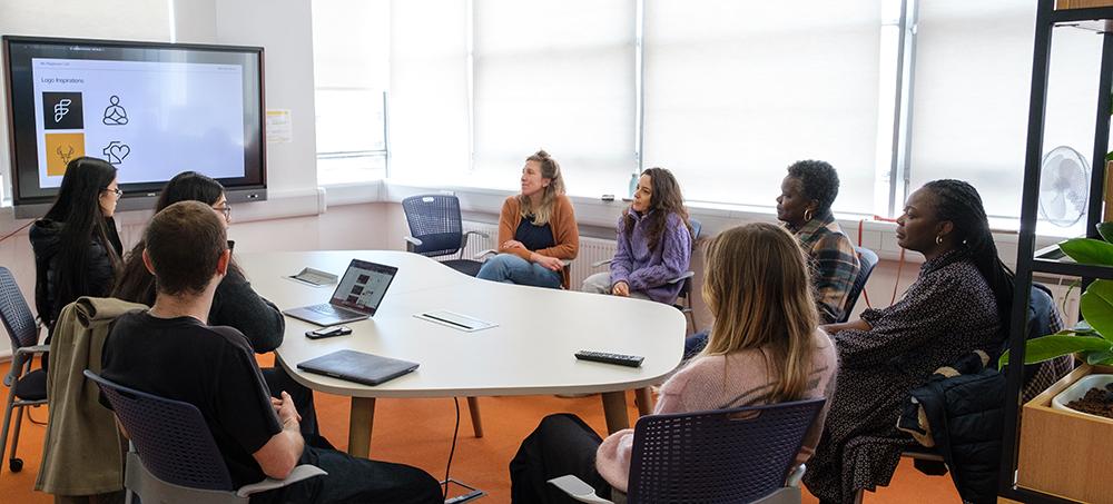 Students attending a client presentation