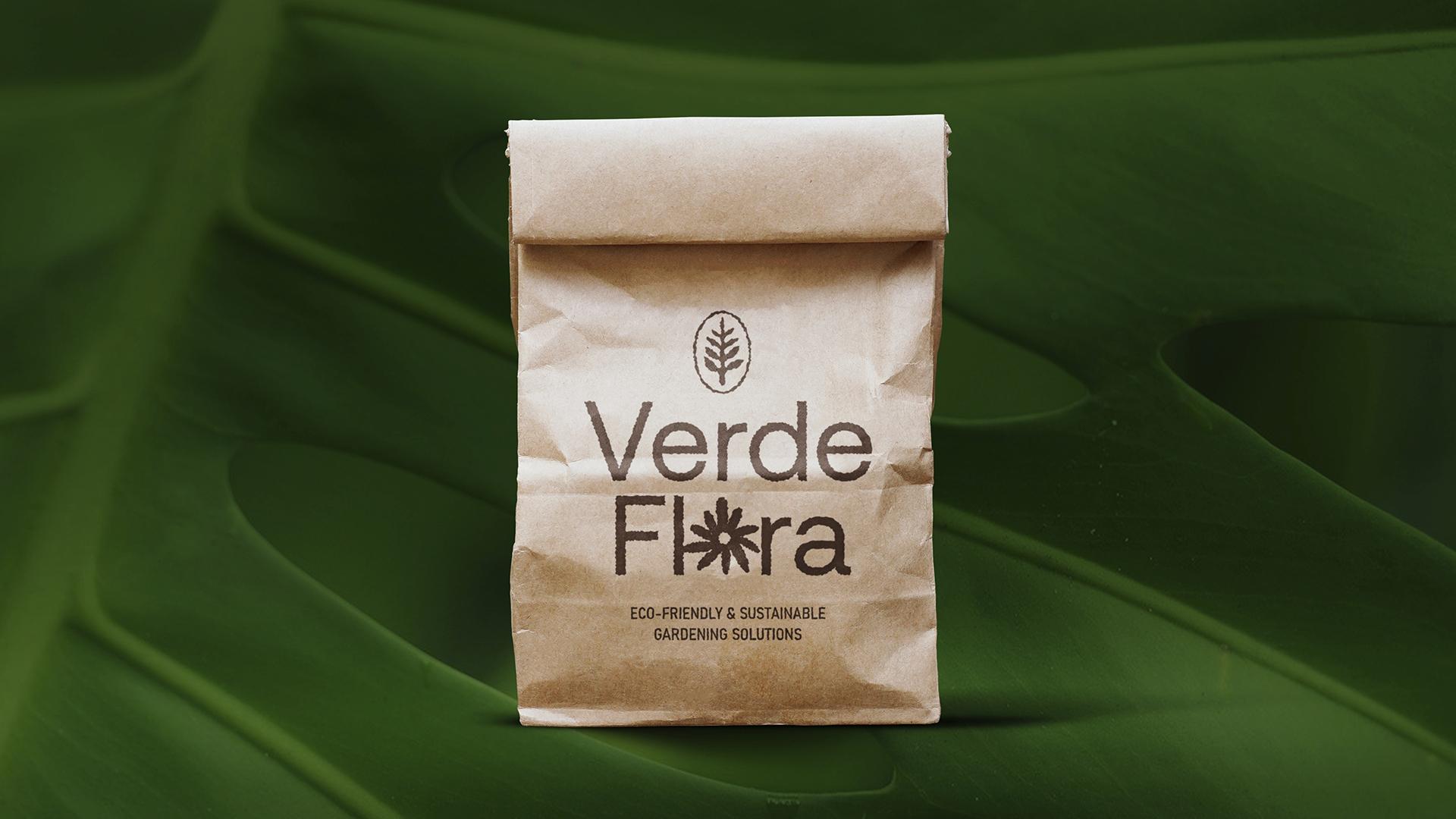 Brown paper bag packaging with logo printed in dark brown.