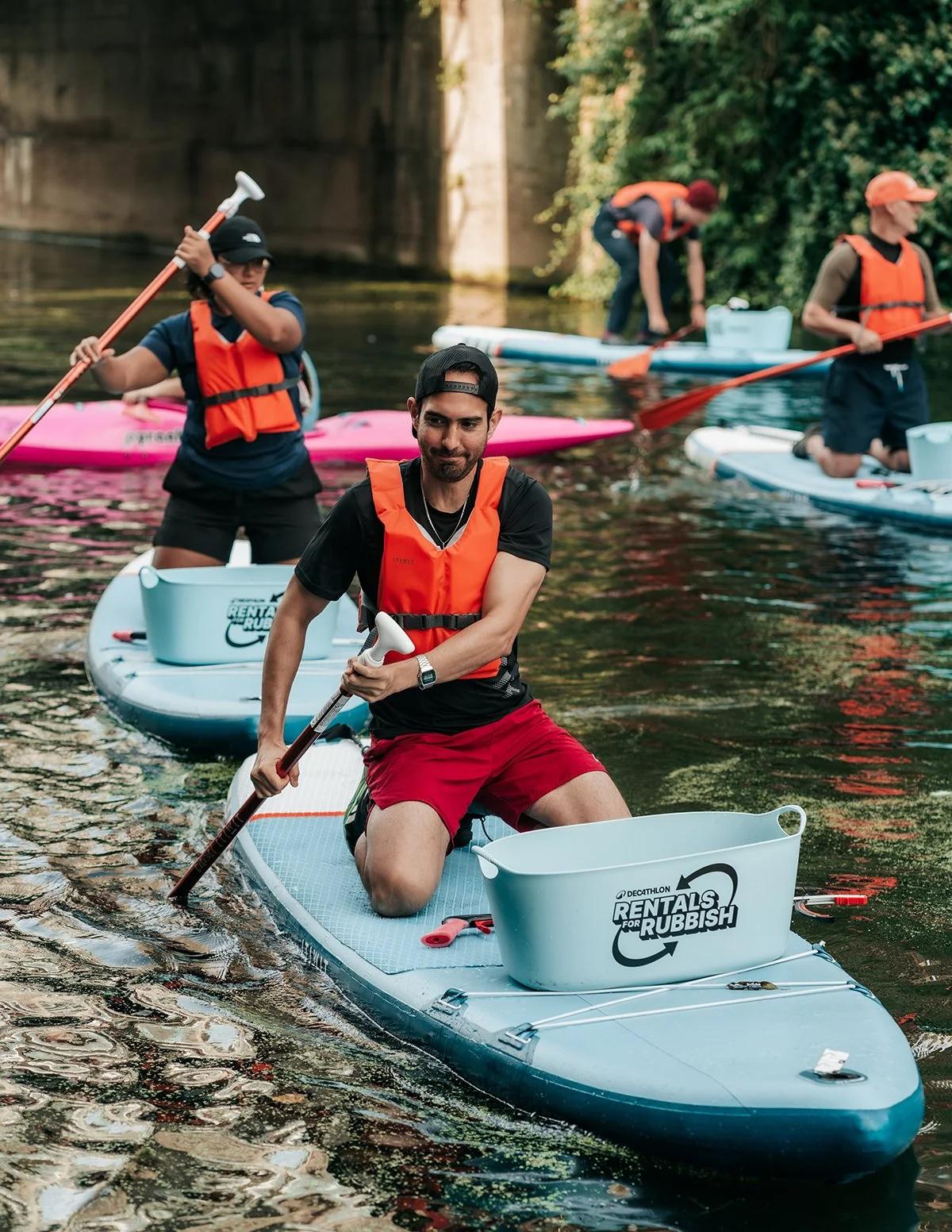 Image of canoeists collecting rubbish.