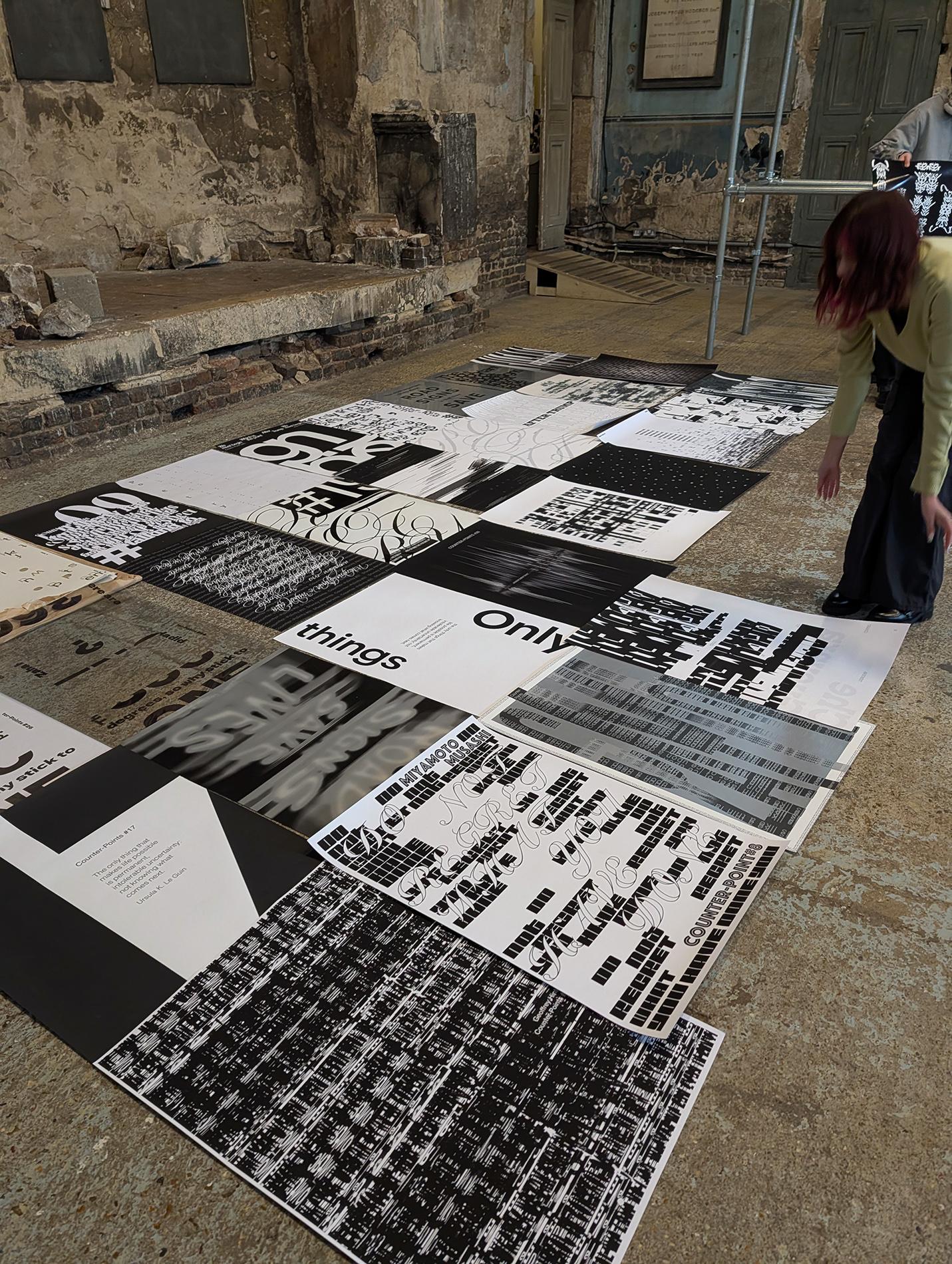 posters laid out on the floor before installation