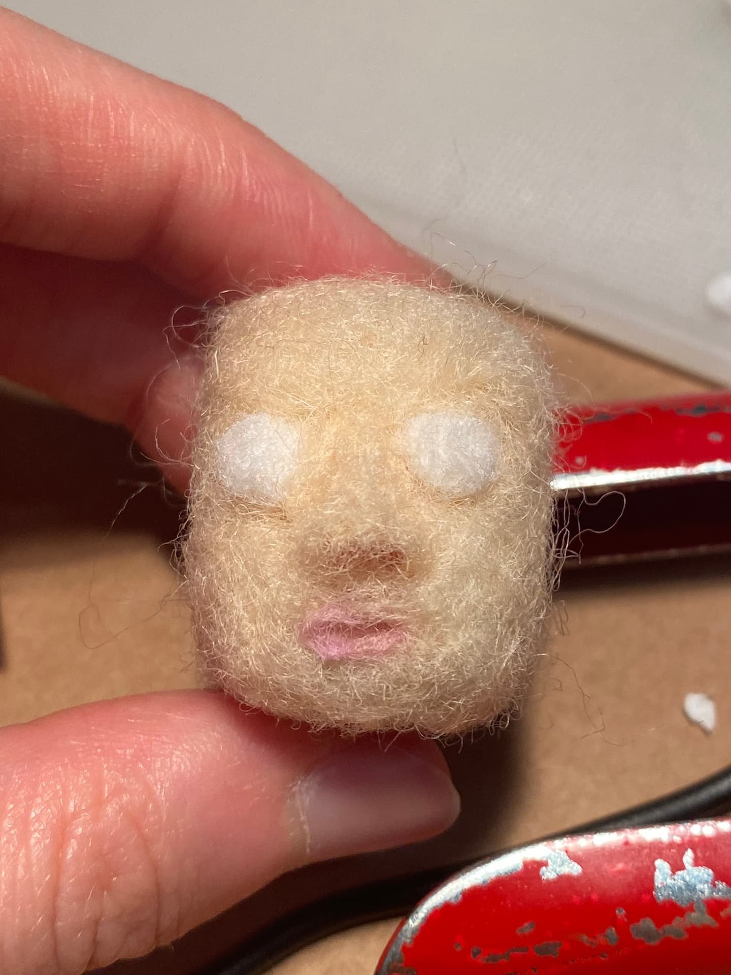 Needle felting the character and bedroom items.