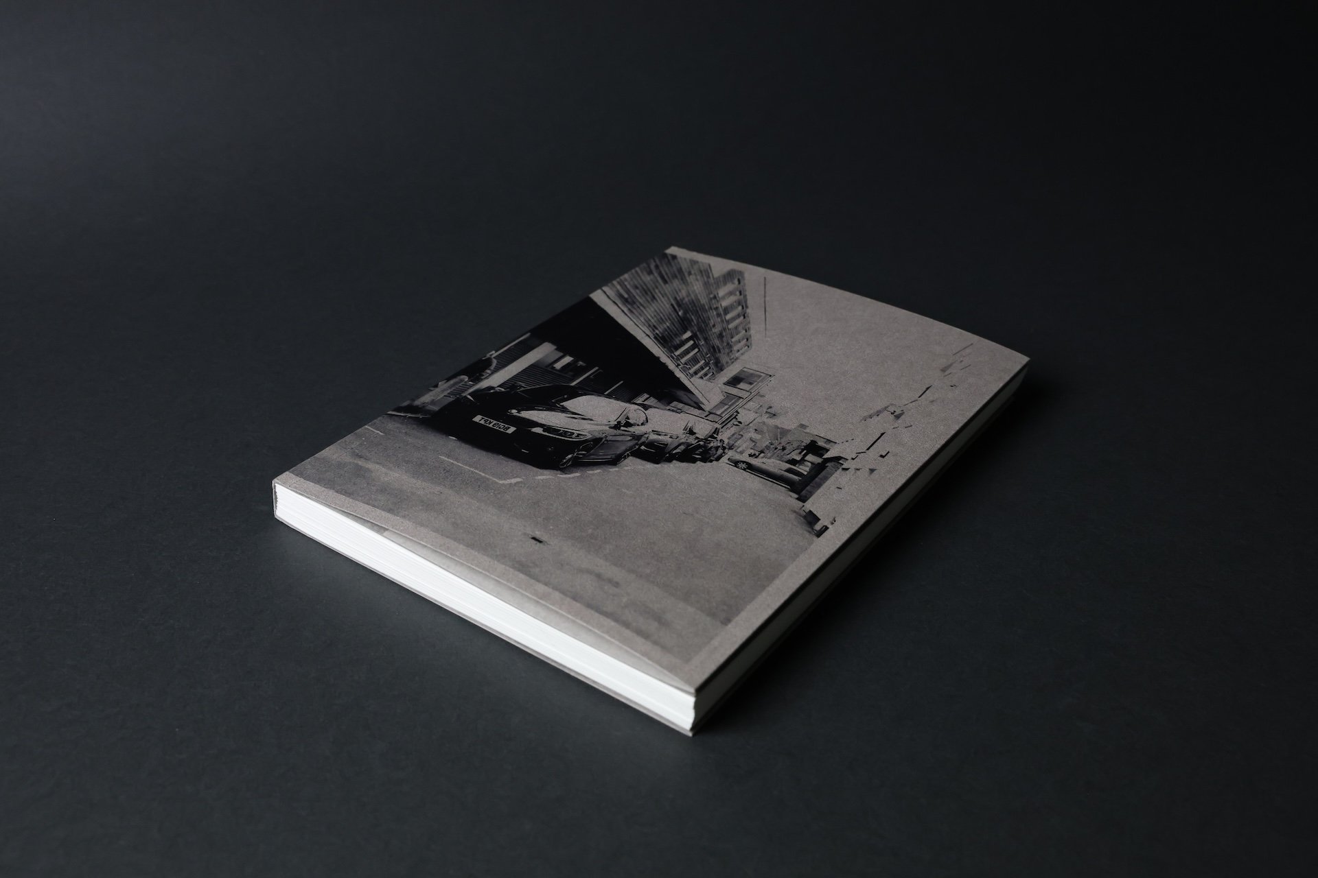 Cover Image—‘a town’. The cover features an elderly Ashford local, symbolising the town’s aging identity. UV printing adds a subtle three-dimensional depth to darker areas, enhancing the image’s texture and mood. Format: 165mm x 220mm.