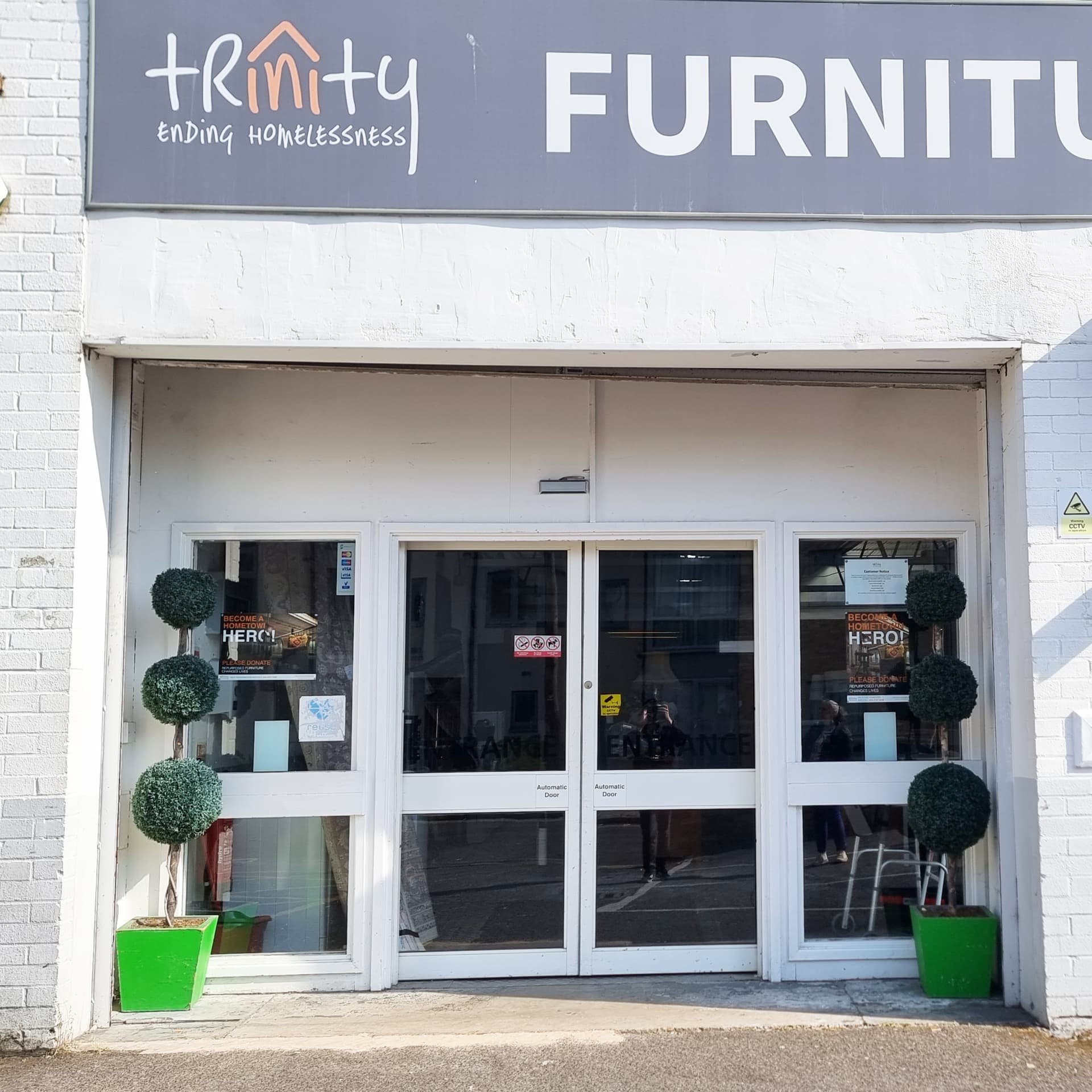 Photograph showing the posters on display in the front of the shop. Click on image to visit Trinity’s website.